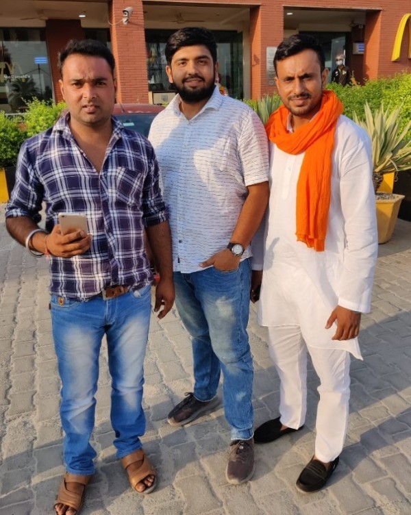 Anuj Chaudhary (right) with his supporters