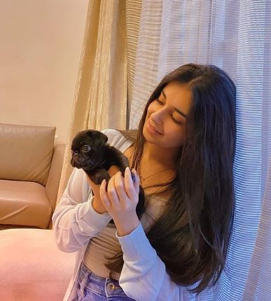 Anvesha Vij with a puppy