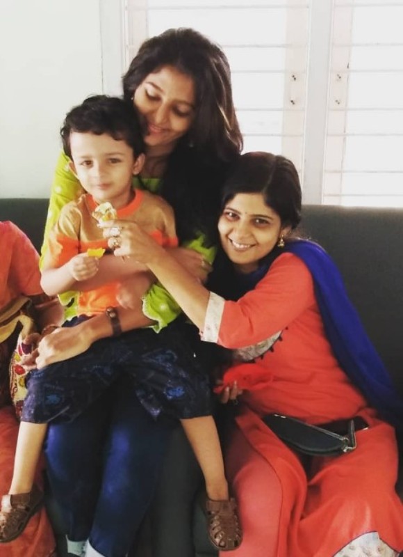 Ashika Asokan with her mother and her brother
