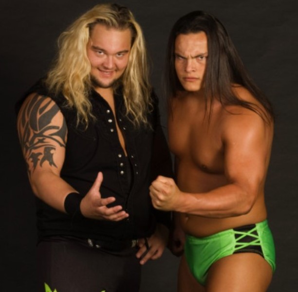 Bray Wyatt (left) with his brother, Bo Dallas, during his early years in FCW