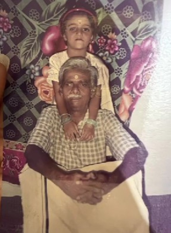 A childhood photograph of Ashika Asokan with her father