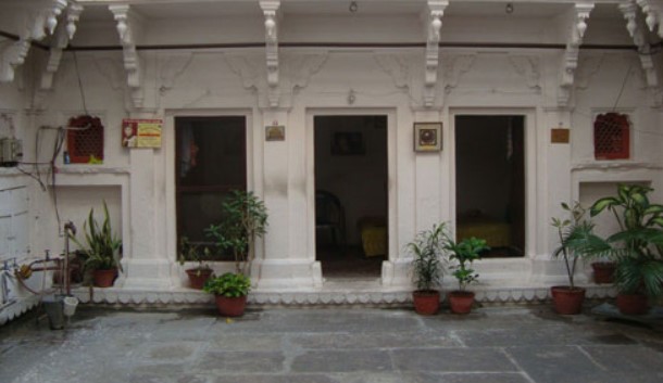 Courtyard of his home showing nice room in front. This is the two story building of old style