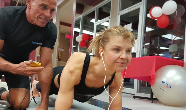 Dana Glowacka practicing abdominal plank with her coach, George Hood