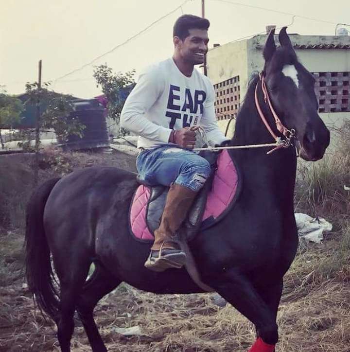 Deepak Niwas Hooda riding on a horse