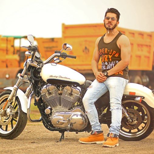 Gitaj Bindrakhia posing with his bike