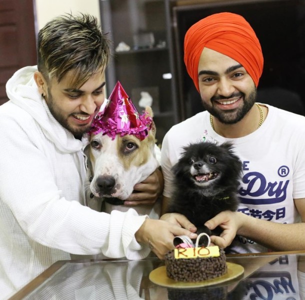 Gitaz Bindrakhia with Jordan Sandhu (right) and their pets