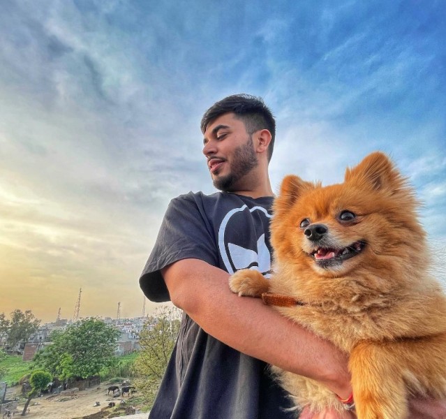 Gitaz Bindrakhia with his pet dog, 'Tyga'