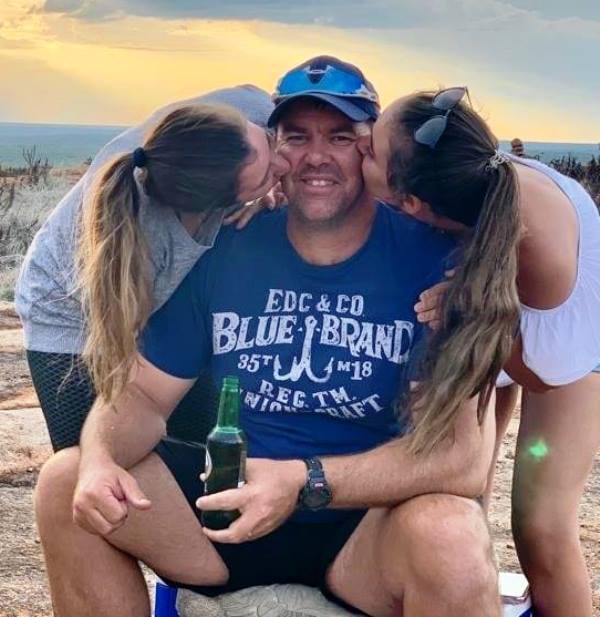 Heath Streak with his daughters, enjoying a bottle of beer