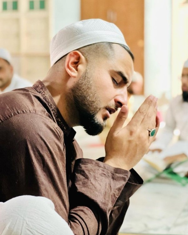 Khan Saab praying at a mosque