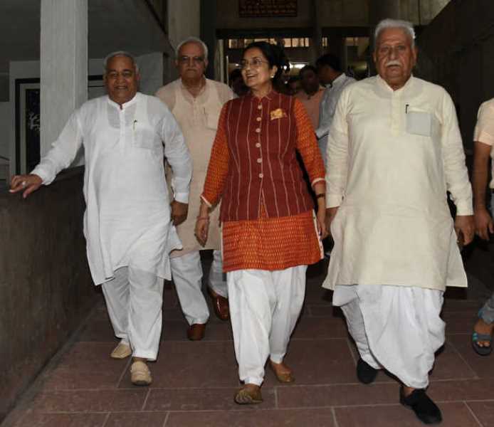 Kiran Choudhry with other party MLAs come out of the Vidhan Sabha