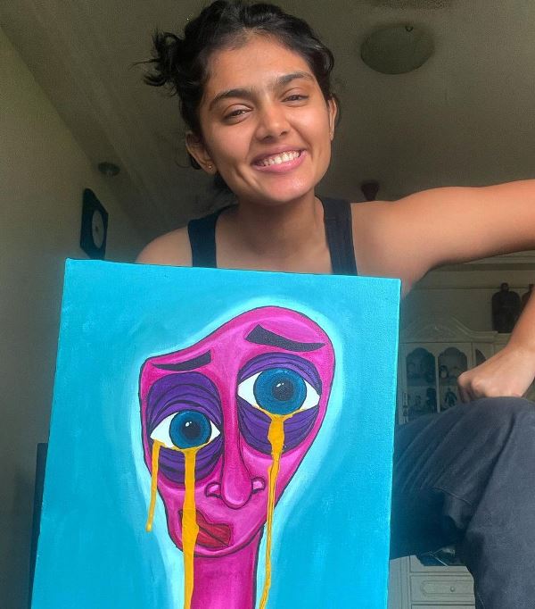 Lehar Khan with a painting made by her