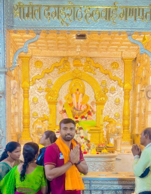 Monu Goyat worshipping in a temple