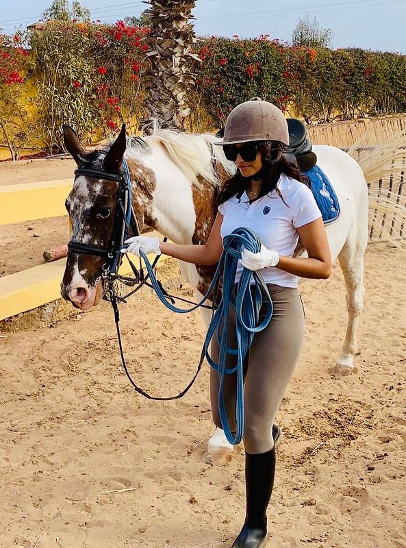 Moroccan Actress Sairi Salma posing with a horse