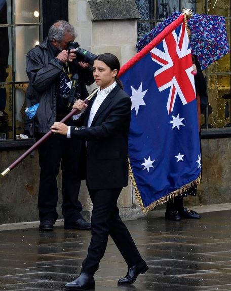 Sam Kerr carrying the Australian flag during the coronation of Charles III and Camilla