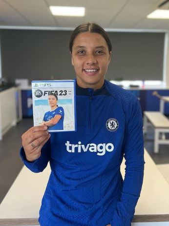 Sam Kerr holding FIFA video game with herself on the cover
