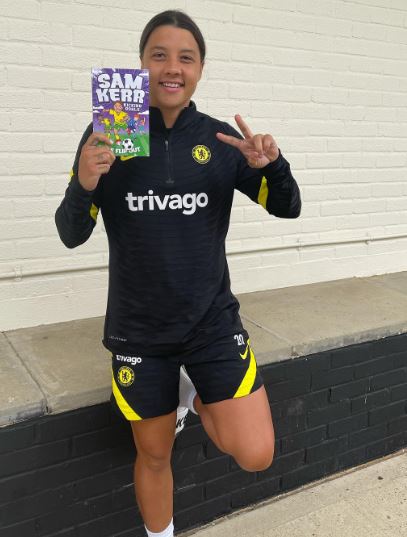 Sam Kerr showing her book after its release