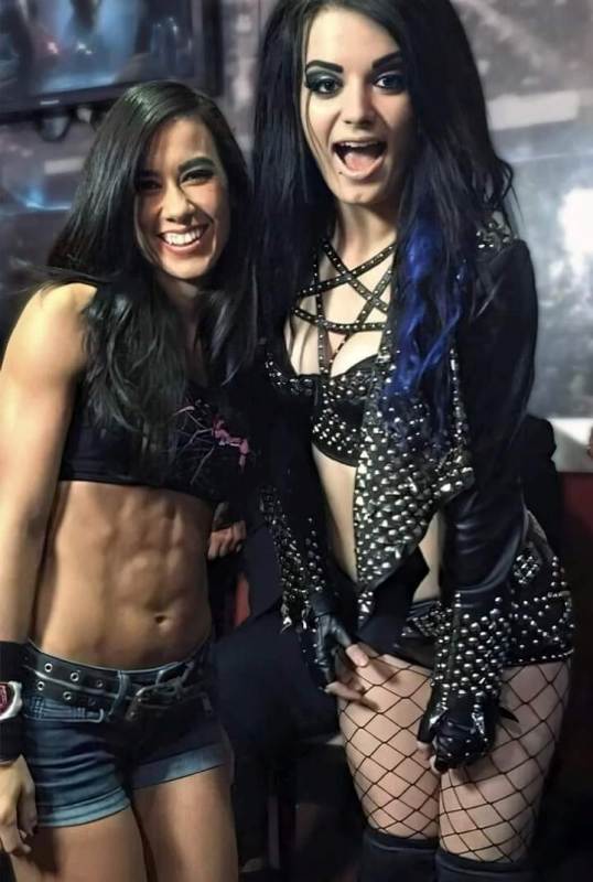 Saraya Bevis aka Paige with AJ Lee (left)
