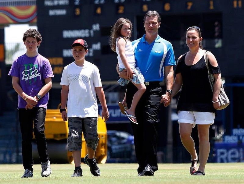 Simon Taufel with his wife and children