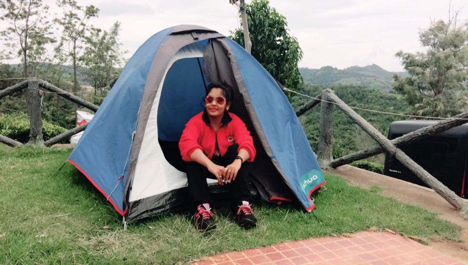 Sruthi Shanmuga Priya camping during a hike