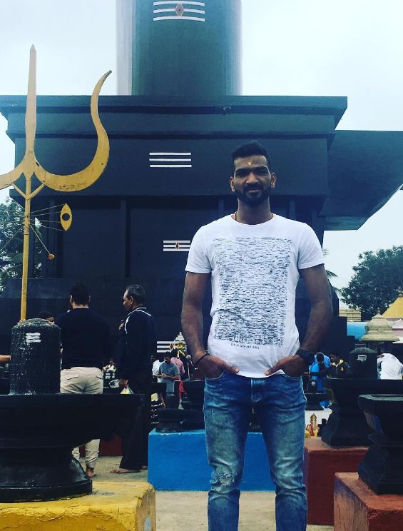Sukesh Hegde in front of a temple