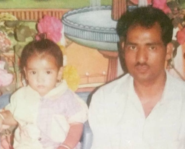 A childhood picture of Bhupender Rawat with his father