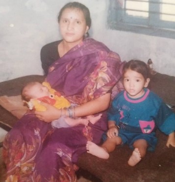 A childhood picture of Bhupender Rawat with his mother and younger sister