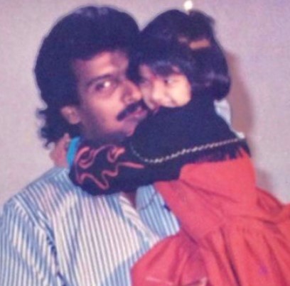 A childhood picture of Keerthi Pandian with her father