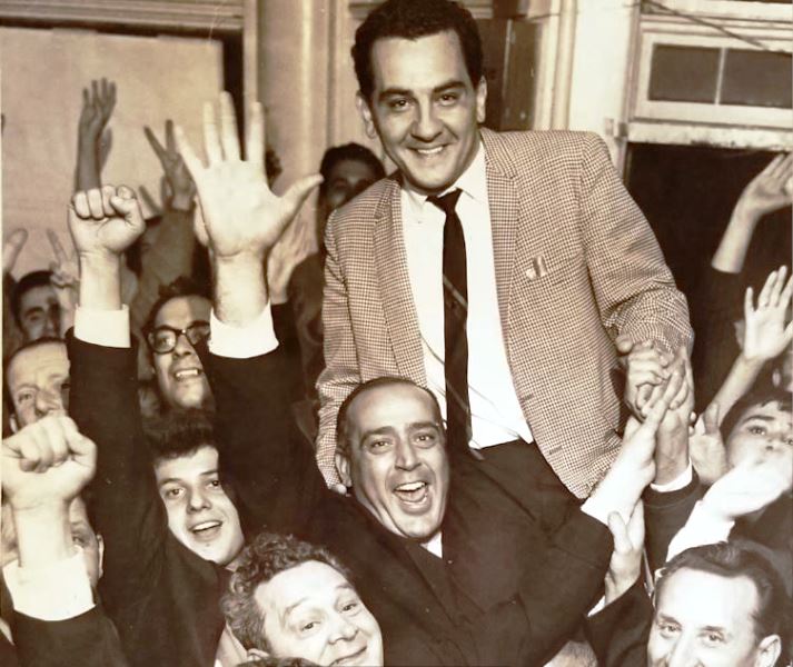A old picture of Frank Caprio Caprio celebrating his Providence City Council victory with his father (in glasses) and supporters in 1962