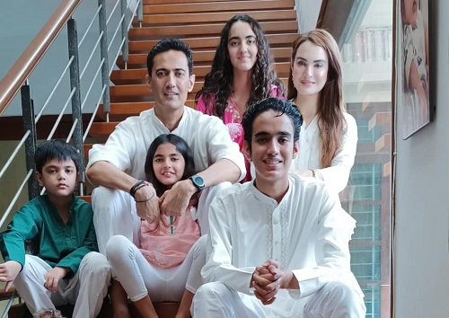 A photo of Nadia Hussain Khan with her husband and children