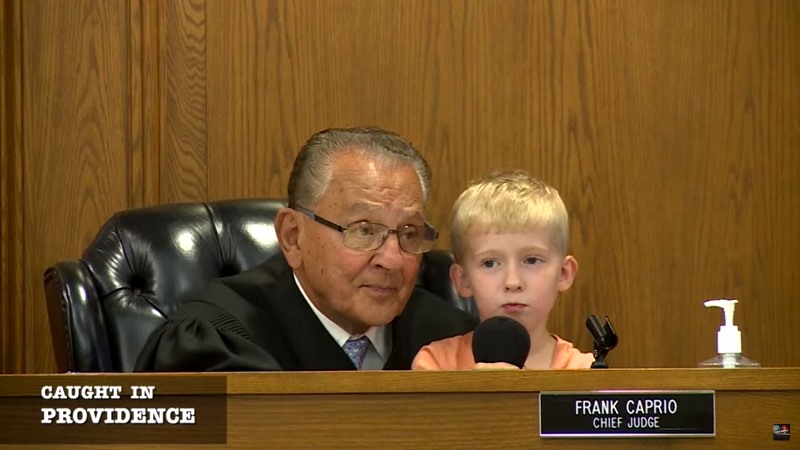 A still from the TV show Caught in Providence featuring Judge Frank Caprio with a kid