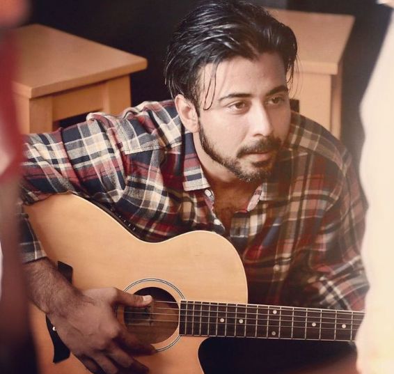 Afran Nisho playing guitar