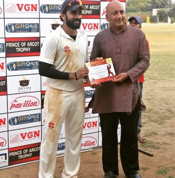 Ashok Selvan while receiving man of the match certificate
