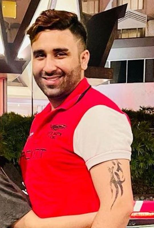 Bilal Shah's tattoo on his left arm's bicep