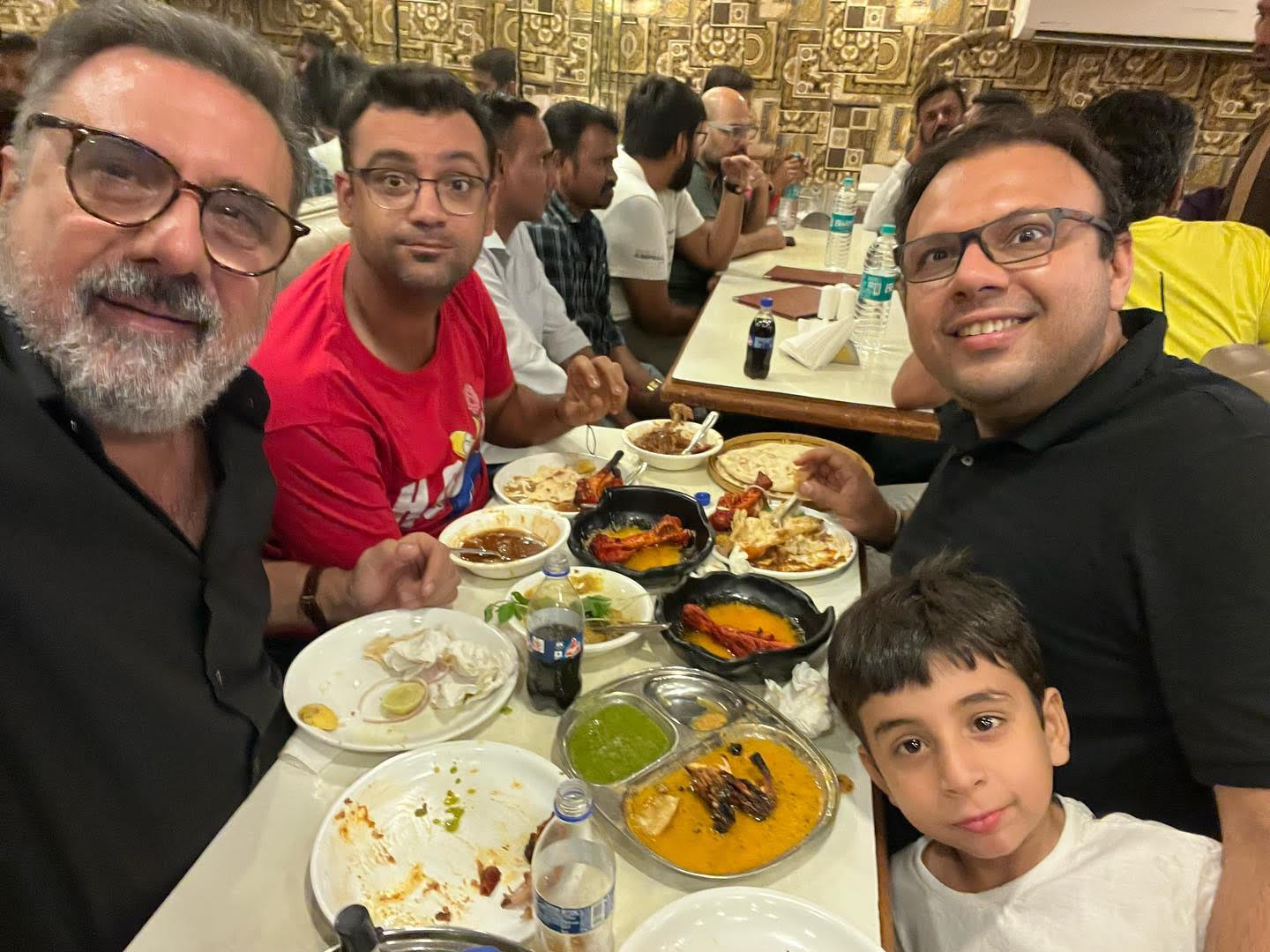 Boman Irani (right) eating non-vegetarian food at a restaurant