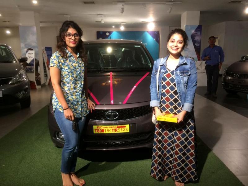 Damini Bhatla (right) buying her Tata Tigor car