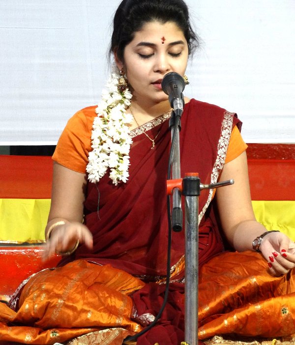Damini Bhatla singing during a religious congregation