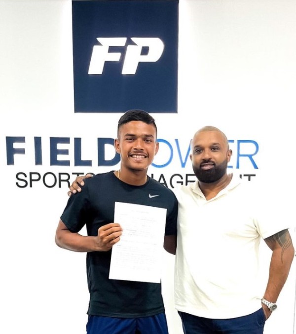 Dunith Wellalage (left) after signing with Field Power Sports Management Company