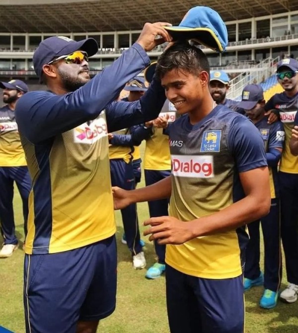 Dunith Wellalage (right) being given his ODI cap by Wanindu Hasaranga on his ODI debut