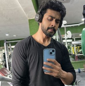 Gautham Krishna posing at a gym