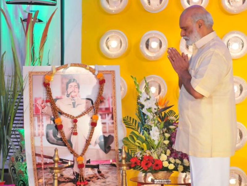 K. Raghavendra Rao in front of N. T. R.'s photo frame