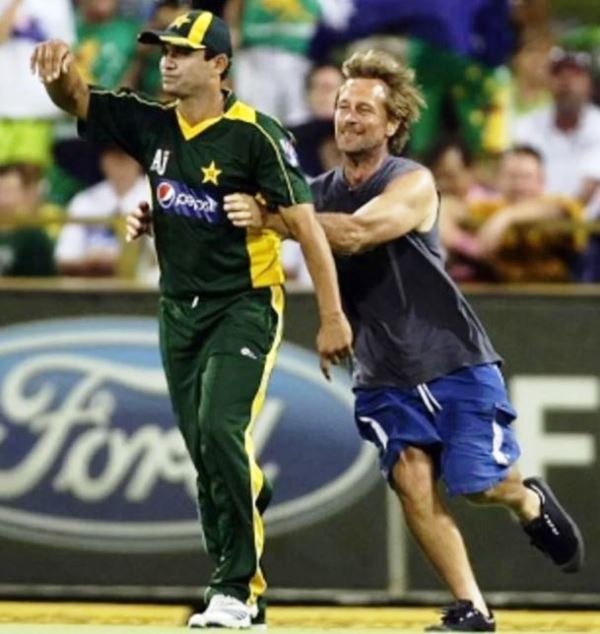 Khalid Latif being brought down by a pitch invader in 2010, during the 5th ODI at Perth against Australia