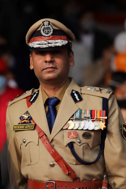 Mukesh Singh attending an event in his uniform with his medals
