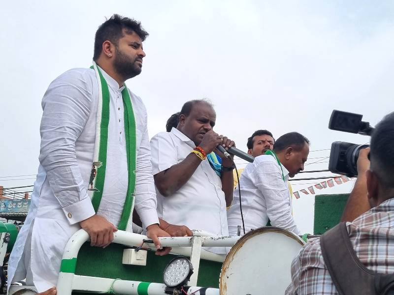 Prajwal Revanna with H. D. Kumaraswamy during a political campaign