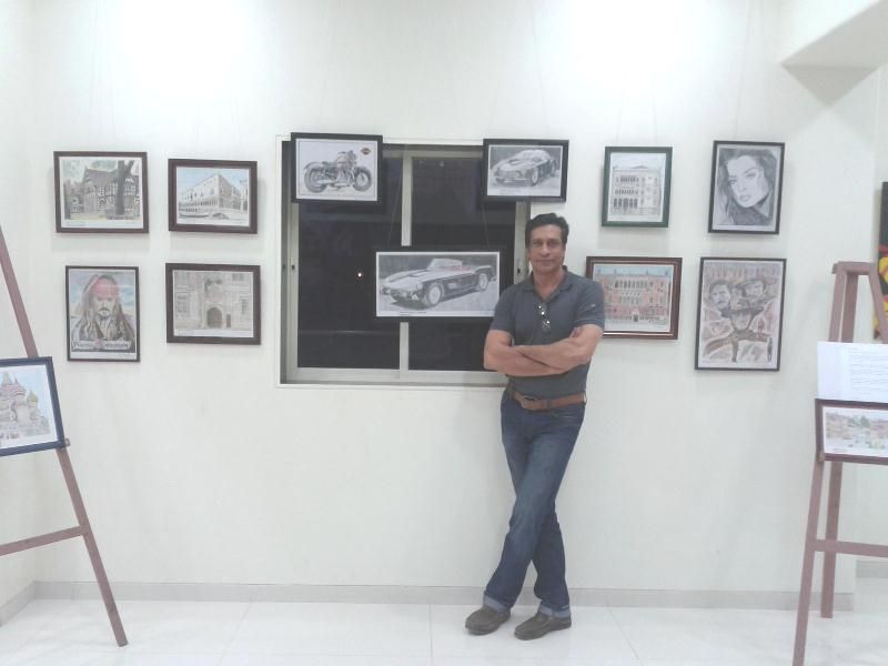 Rio Kapadia with his artworks