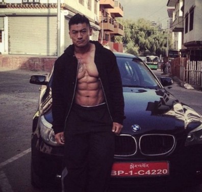 Sangay Tsheltrim posing with his BMW