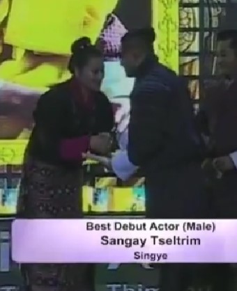 Sangay Tsheltrim while receiving Best Debut actor award