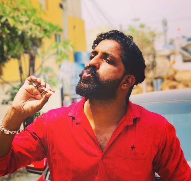 Sanjay Krishna while smoking a cigarette