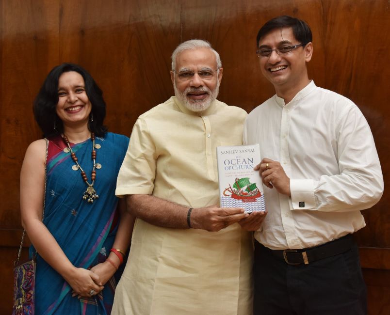 Sanjeev Sanyal presenting his book The Ocean of Churn to PM Narendra Modi
