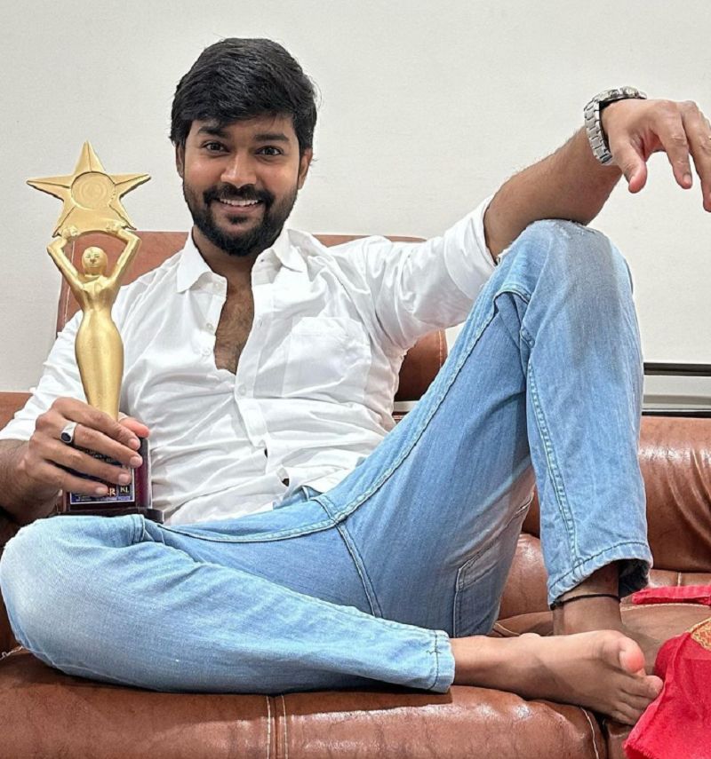 Shivkumar Marihal posing with Best Hero Award