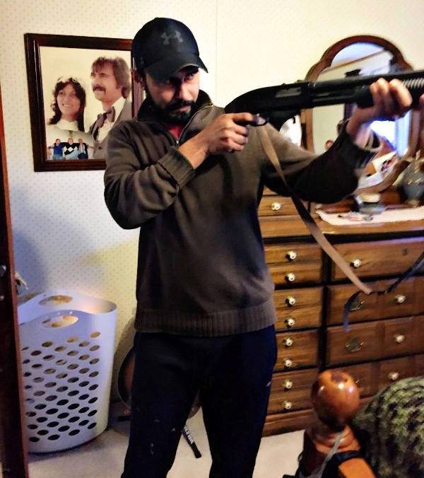 Sukha Duneke wielding a rifle